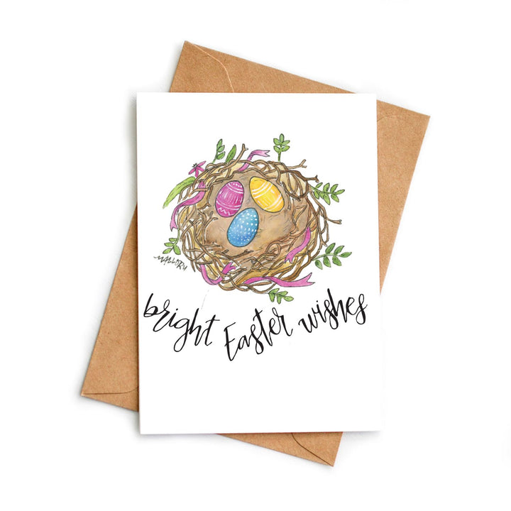Easter greeting card with a nest and colorful eggs on a white background