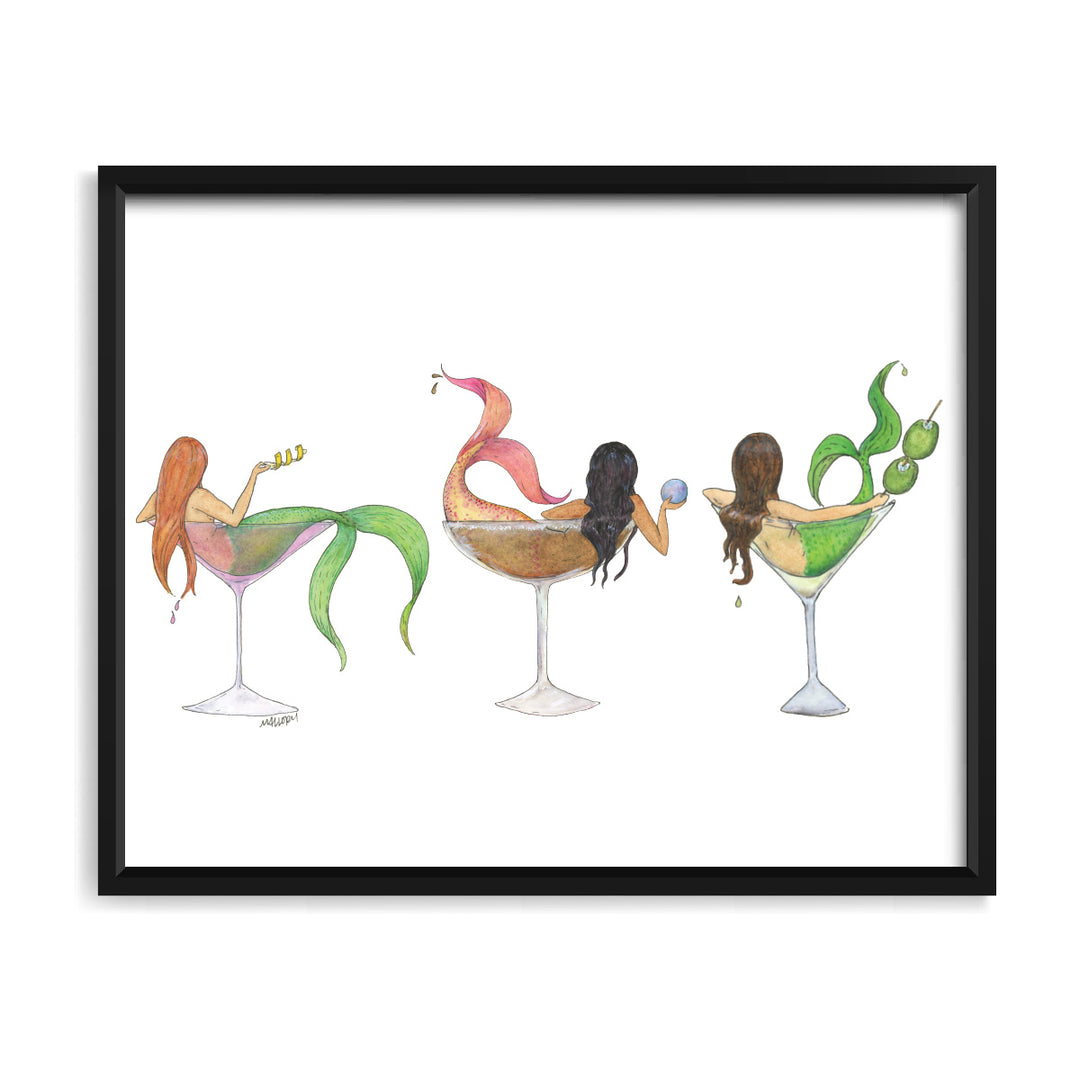 Framed artwork of three mermaids in cocktail glasses with a white background
