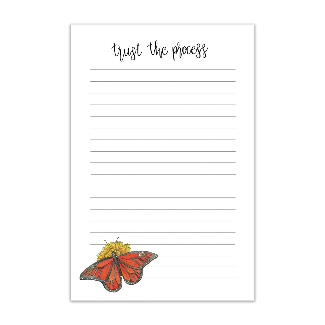 Lined notepad with a butterfly illustration and 'trust the process' text on a white background